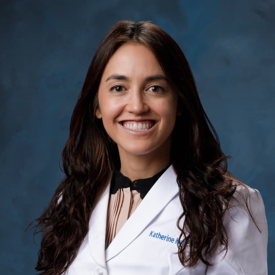 Portrait of Dr. Katherine Hom in a white coat, smiling